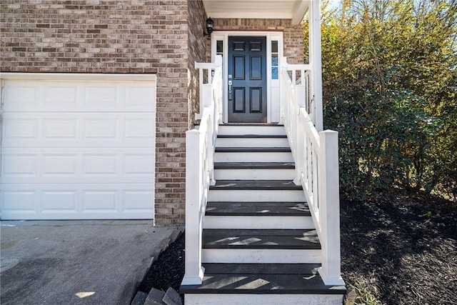 doorway to property featuring a garage