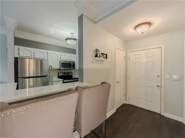 2700 Pine Tree Rd NE Unit 1013, Atlanta, GA 30324 - foyer with dark wood finished floors, baseboards, and crown molding