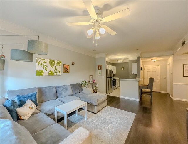 2700 Pine Tree Rd NE Unit 1013, Atlanta, GA 30324 - living room featuring crown molding, ceiling fan, dark wood-style flooring, and baseboards
