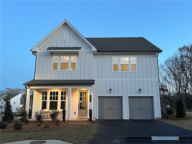 modern inspired farmhouse with a garage