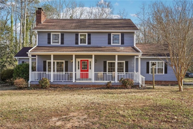 view of front of property with a porch and a front yard