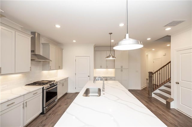 816 Dodd Trl S Unit 172, Buford, GA 30518 - kitchen with stainless steel range with gas stovetop, wall chimney exhaust hood, a sink, dark wood-style floors, and recessed lighting