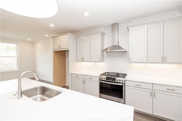 816 Dodd Trl S Unit 172, Buford, GA 30518 - kitchen featuring stainless steel range with gas stovetop, wall chimney exhaust hood, a sink, light countertops, and recessed lighting