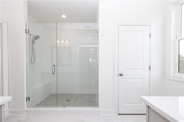 816 Dodd Trl S Unit 172, Buford, GA 30518 - bathroom featuring vanity, a shower stall, baseboards, marble look tile flooring, and recessed lighting