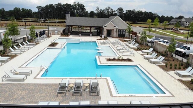 816 Dodd Trl S Unit 172, Buford, GA 30518 - community pool with view of wooded area and a patio