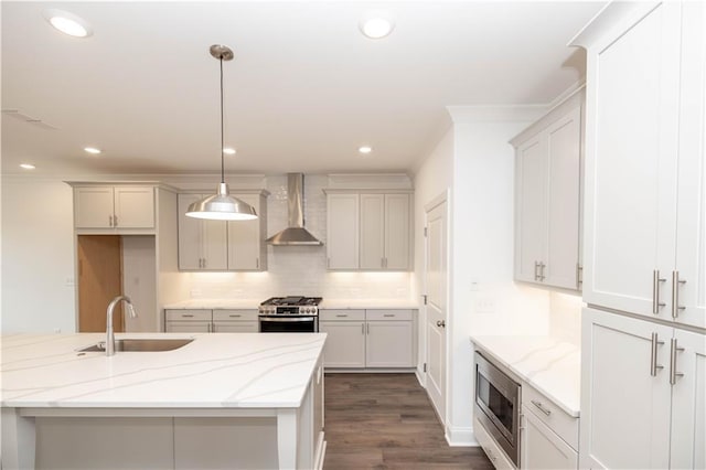 816 Dodd Trl S Unit 172, Buford, GA 30518 - kitchen featuring wall chimney range hood, stainless steel appliances, a sink, decorative backsplash, and light stone counters