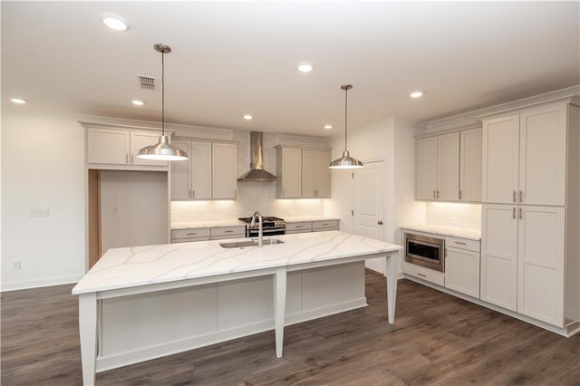816 Dodd Trl S Unit 172, Buford, GA 30518 - kitchen featuring wall chimney exhaust hood, a sink, decorative backsplash, stainless steel microwave, and recessed lighting