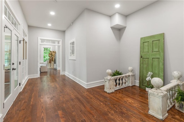 entryway with recessed lighting, french doors, baseboards, and wood finished floors