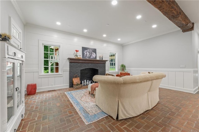 living area featuring recessed lighting, a brick fireplace, crown molding, and brick floor