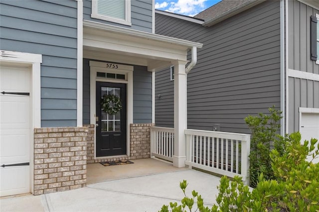 5755 Turnstone Trl, Flowery Branch, GA 30542 - view of exterior entry featuring covered porch