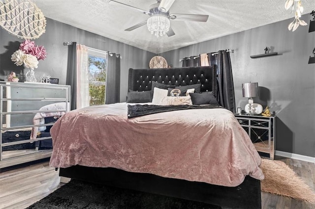 5143 3rd St, Morrow, GA 30260 - bedroom with wood finished floors, a textured ceiling, and ceiling fan