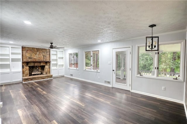 unfurnished living room with a ceiling fan, dark wood-type flooring, baseboards, a chandelier, and ornamental molding
