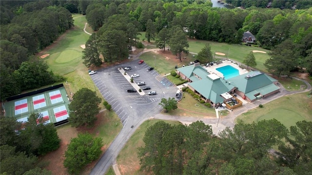 aerial overview of property's location featuring a pool area and a golf course