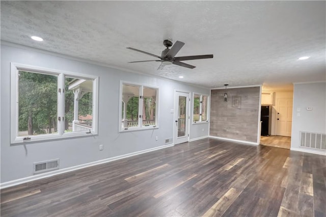 unfurnished living room with a ceiling fan, dark wood-type flooring, baseboards, ornamental molding, and recessed lighting