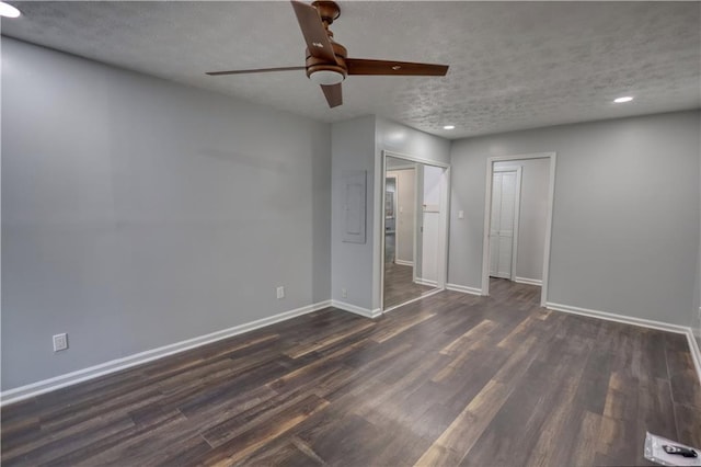 unfurnished bedroom featuring baseboards, dark wood-style flooring, recessed lighting, a textured ceiling, and a ceiling fan