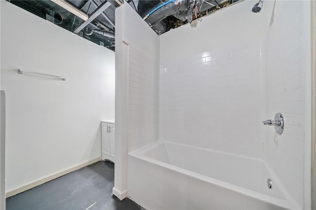 full bathroom featuring baseboards, shower / washtub combination, and concrete flooring