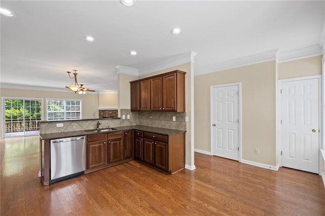 5159 Wellsley Bnd, Alpharetta, GA 30005 - kitchen with stainless steel dishwasher, a sink, dark countertops, crown molding, and tasteful backsplash