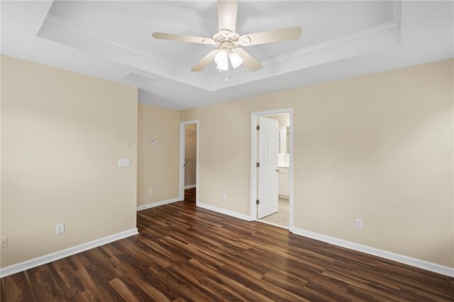 5159 Wellsley Bnd, Alpharetta, GA 30005 - empty room featuring a tray ceiling, dark wood finished floors, ornamental molding, baseboards, and ceiling fan