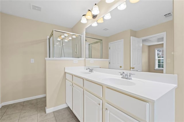 5159 Wellsley Bnd, Alpharetta, GA 30005 - bathroom featuring double vanity, a stall shower, baseboards, and tile patterned flooring