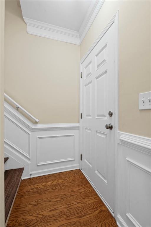 5159 Wellsley Bnd, Alpharetta, GA 30005 - doorway to outside featuring crown molding, wainscoting, a decorative wall, and dark wood-style floors