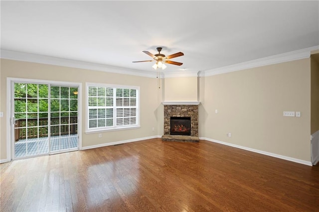 5159 Wellsley Bnd, Alpharetta, GA 30005 - unfurnished living room with plenty of natural light, ceiling fan, wood finished floors, baseboards, and ornamental molding