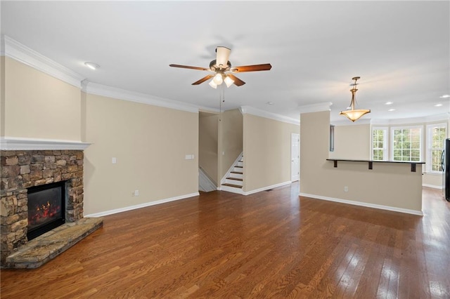 5159 Wellsley Bnd, Alpharetta, GA 30005 - unfurnished living room with a fireplace, crown molding, ceiling fan, stairs, and wood finished floors