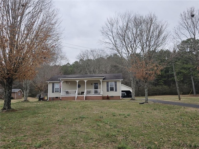 view of front of home with a front lawn and covered porch