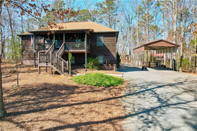 exterior space with a porch and a carport