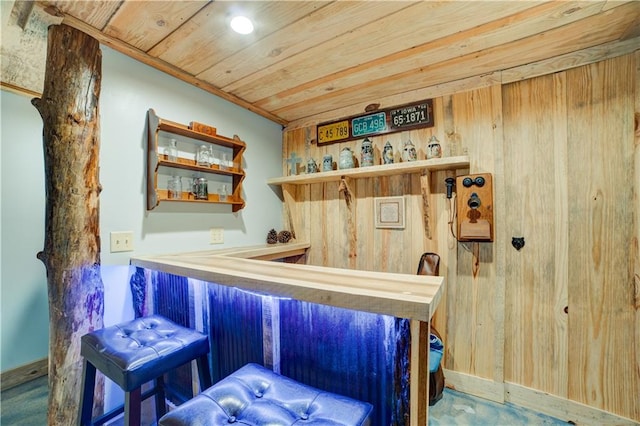 bar with wooden ceiling and wood walls