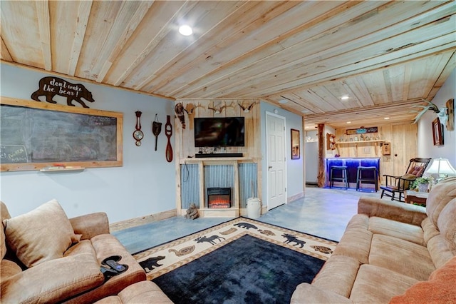 living room with concrete flooring and wooden ceiling