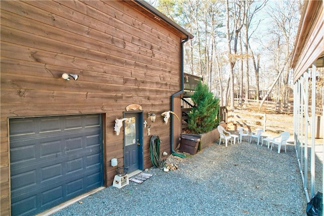 view of property exterior featuring a garage