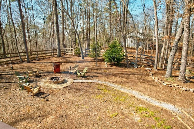 view of yard featuring a fire pit