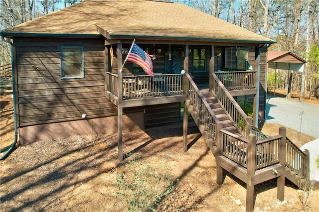 back of property featuring a porch