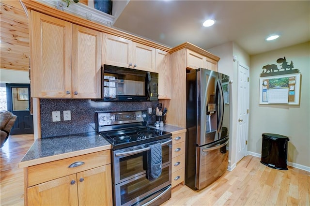 kitchen featuring light brown cabinetry, backsplash, appliances with stainless steel finishes, and light hardwood / wood-style flooring