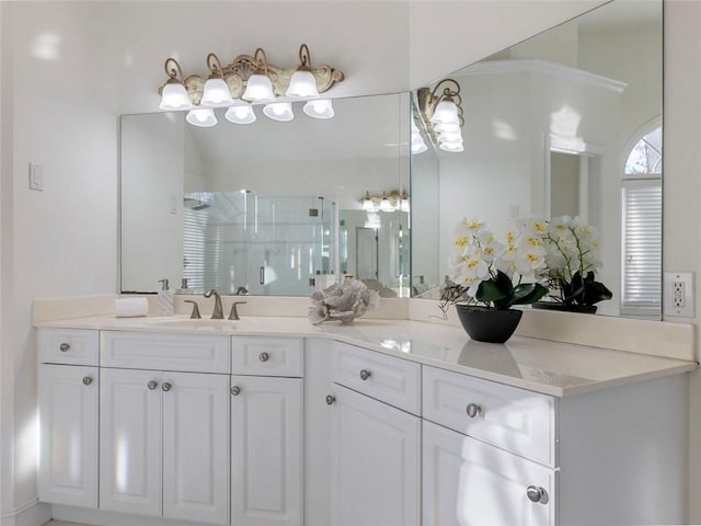 bathroom featuring vanity and an enclosed shower