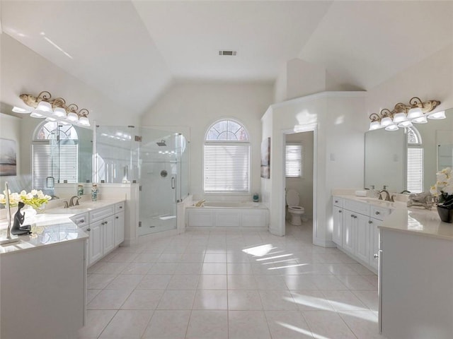 2750 Olde Towne Pkwy, Duluth, GA 30097 - full bathroom with a stall shower, a bath, two vanities, tile patterned flooring, and high vaulted ceiling