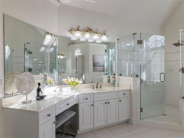 2750 Olde Towne Pkwy, Duluth, GA 30097 - bathroom featuring vanity, lofted ceiling, a stall shower, and tile patterned floors