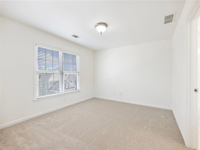 empty room with light colored carpet