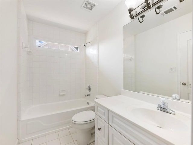 full bathroom featuring vanity, tile patterned flooring, tiled shower / bath, and toilet