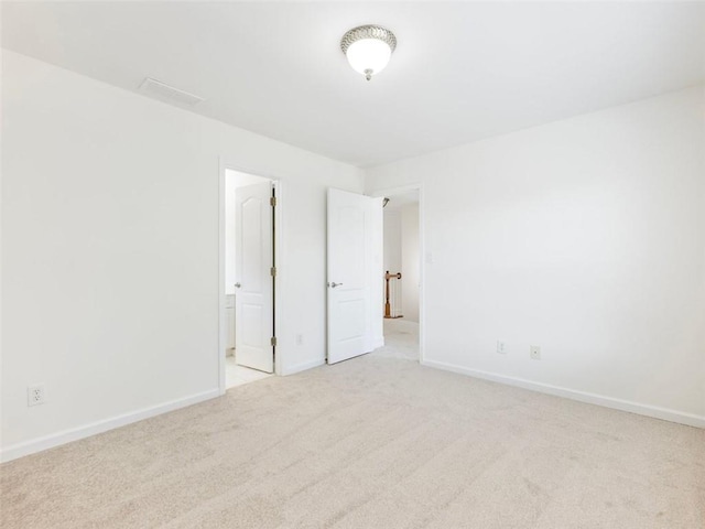 2750 Olde Towne Pkwy, Duluth, GA 30097 - unfurnished bedroom with light carpet, baseboards, and connected bathroom