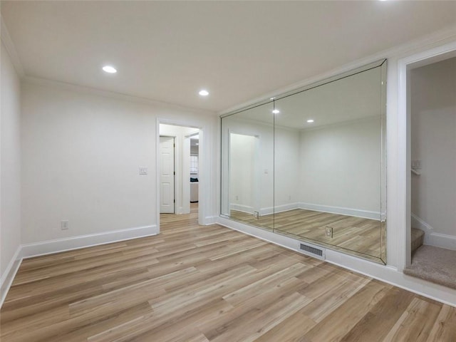 2750 Olde Towne Pkwy, Duluth, GA 30097 - unfurnished bedroom with light wood-style floors, baseboards, recessed lighting, a closet, and ornamental molding