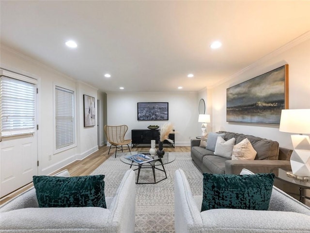 living room with light hardwood / wood-style floors and ornamental molding