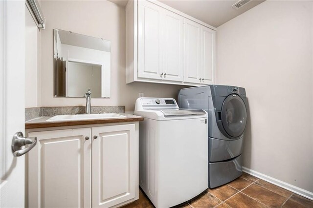 1898 Alcovy Shoals Blf SE, Lawrenceville, GA 30045 - laundry room featuring cabinet space, independent washer and dryer, and baseboards