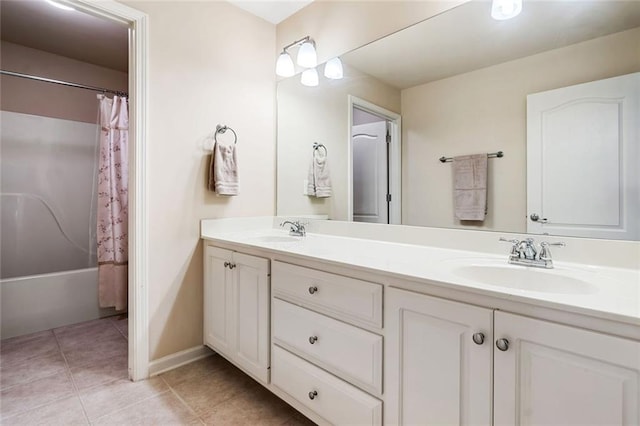 1898 Alcovy Shoals Blf SE, Lawrenceville, GA 30045 - full bathroom with double vanity, tile patterned flooring, shower / tub combo with curtain, and baseboards