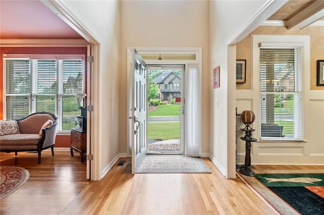 1898 Alcovy Shoals Blf SE, Lawrenceville, GA 30045 - foyer entrance featuring light wood-style flooring, healthy amount of natural light, baseboards, and crown molding