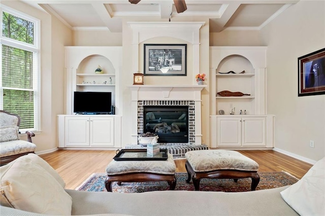 1898 Alcovy Shoals Blf SE, Lawrenceville, GA 30045 - living room featuring wood finished floors, baseboards, a ceiling fan, coffered ceiling, and beamed ceiling