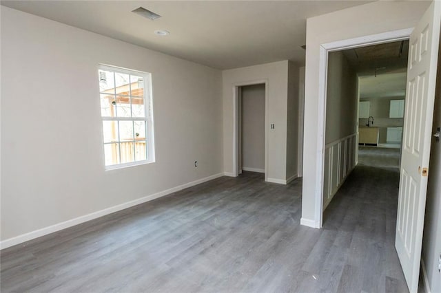 2191 Camp Ground Rd, Atlanta, GA 30331 - unfurnished bedroom featuring wood finished floors, attic access, and baseboards