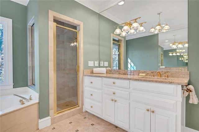 bathroom with a shower stall, a garden tub, crown molding, and a chandelier