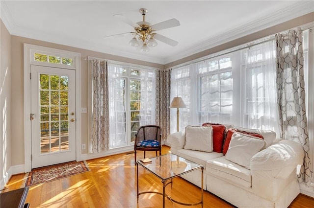 sunroom / solarium with a ceiling fan