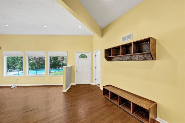 entrance foyer featuring wood finished floors, beam ceiling, baseboards, and recessed lighting